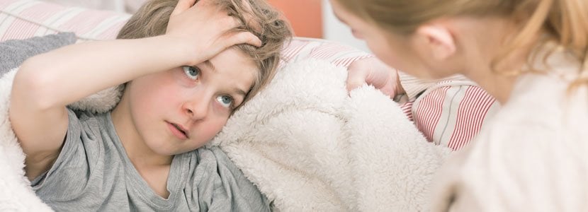 Child holding his head