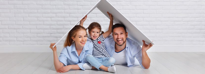 Smiling father, mother and daughter